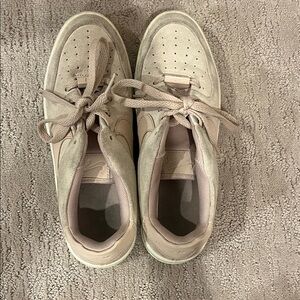Light pink high top Nike Air Force’s